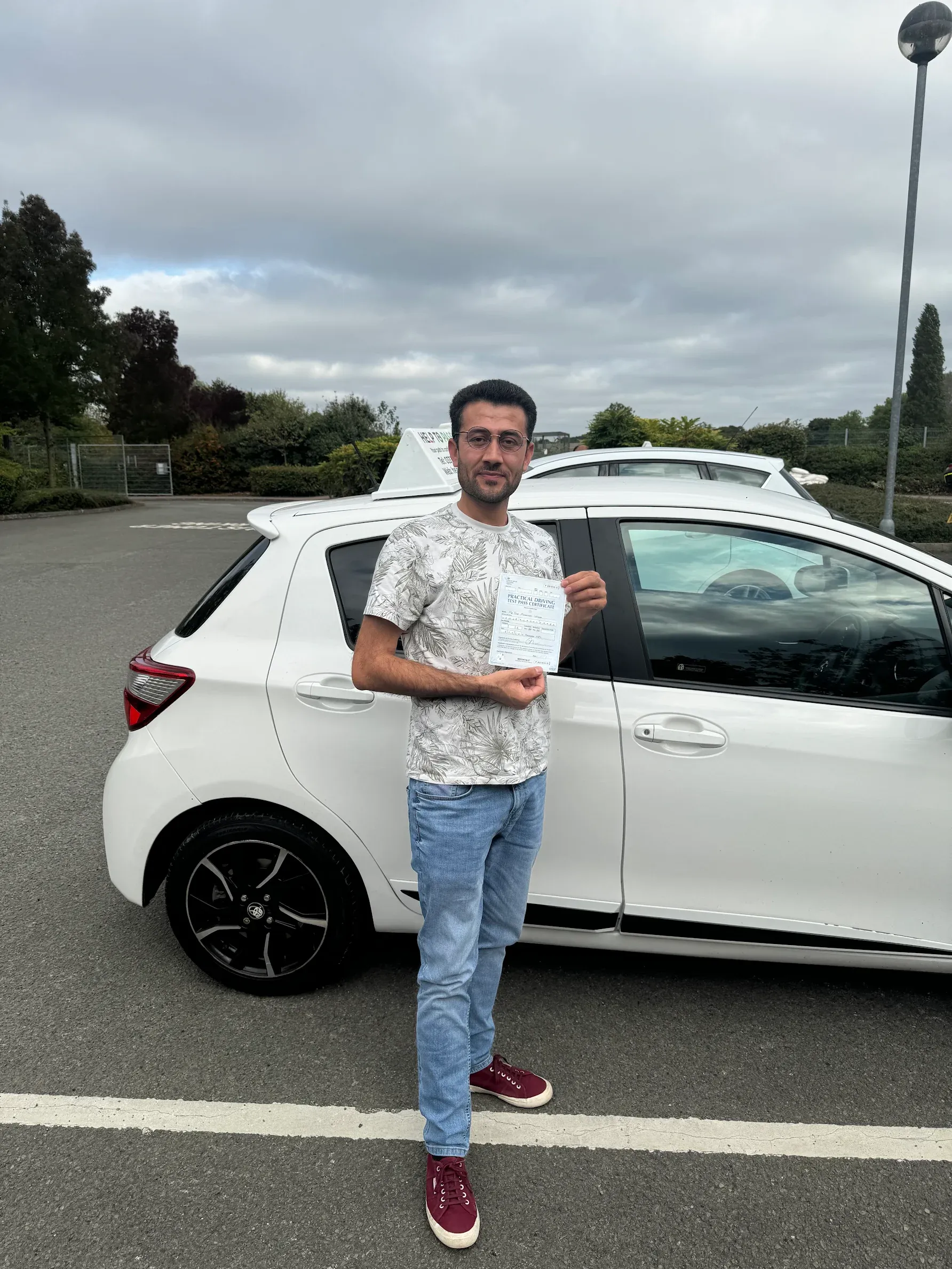 Dur Weqar, holding his practical driving test pass certificate